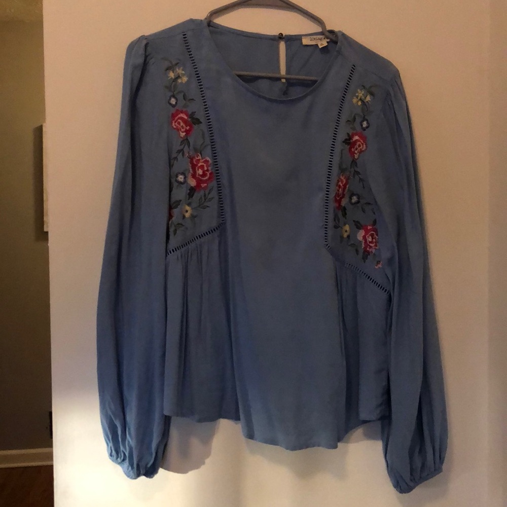 Cute blue blouse with floral design